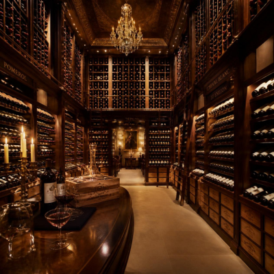 A luxurious wine cellar in a luxury hotel that illustrates the statistics of the global wine hospitality industry: more than 700,000 hotels, 15% of premium wine consumption, and annual purchases totaling more than 10 billion euros